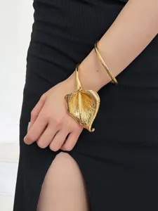 Gold metallic sculptural calla lily bracelet and sleek plain ring bangle set for women.