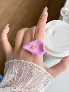 Pink enamel calla lily ring detail close-up, stylish open finger ring accessory for women.