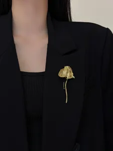 Elegant gold metal leaf brooch, vintage style pin for blazers and coats, chic accessory.