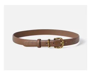 Elegant brown crocodile pattern leather belt for women with retro metal pin buckle.