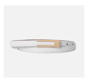 Close up detail of white thin leather belt featuring a sleek golden metal buckle accessory.