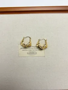 Niche design metal retro geometric earrings, stylish irregular gold hoop earrings for women.