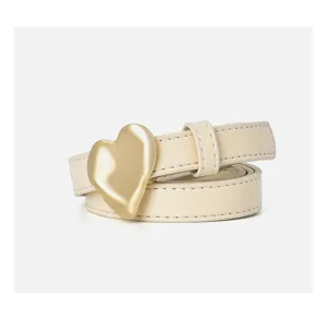 Detail shot of a minimalist women's belt featuring a chunky gold heart buckle and beige leather band.