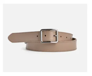 Minimalist genuine leather women's belt detail close-up showing elegant square metal buckle.