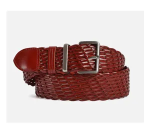 Close-up of a braided leather belt detail, showing woven texture and silver buckle.