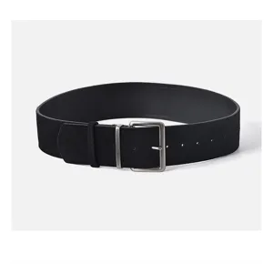Women minimalist black matte leather belt detail close-up, stylish alloy pin buckle.