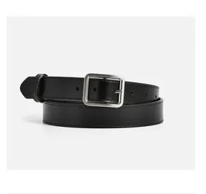 Detailed view of women's black leather belt with silver pin buckle for stylish outfits.