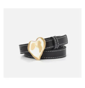 Close-up view of a stylish black leather belt featuring a unique gold irregular heart buckle.