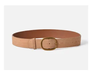 Detailed view of the elegant suede leather women's belt with a vintage gold buckle.