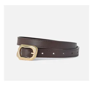 Detail view of a stylish dark brown leather women belt featuring a unique gold metal buckle.