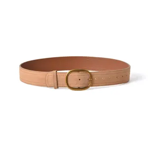 Women's suede leather belt with vintage oval metal buckle, versatile stylish waist accessory.