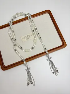 French luxury pearl bow tassel necklace, elegant layered long sweater chain for women.