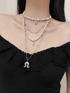 Multi-layer pearl choker necklace with vintage gold chain and horseshoe pendant for women