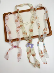 Vintage floral silk scarf necklace for women, elegant beaded sweater chain accessory.
