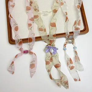 Vintage floral silk scarf necklace for women, elegant beaded sweater chain fashion accessory.