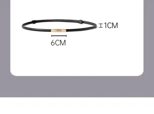 Detailed close-up shot of a thin black women's belt featuring a gold metal buckle, 1cm wide.
