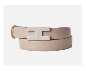 Elegant women's leather belt with stylish metal buckle for dresses and casual wear.