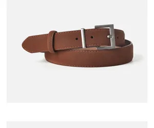 Close-up detail of the brown retro suede women leather belt buckle and texture craft.