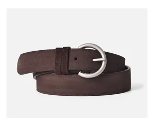 Detailed shot of a women's dark brown suede pin buckle belt, vintage style for jeans and dresses.