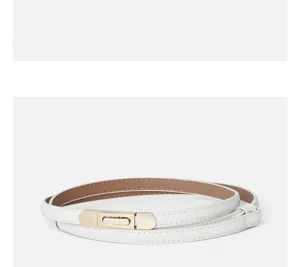 Detail view of white thin genuine leather women belt with elegant gold metal clasp design.