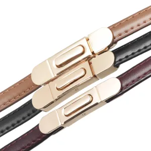 Slim leather belt for women with elegant golden metal buckle, versatile dress waist belt.