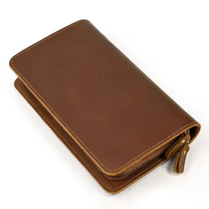 Vintage crazy horse leather long wallet, detailed view of premium brown cowhide and zipper.
