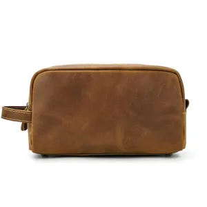 Vintage leather toiletry bag for men and women, premium travel makeup pouch detail view.