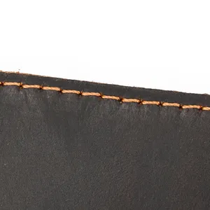 Detailed view of genuine crazy horse leather card holder showing neat brown contrast stitching.