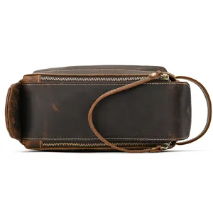 Vintage crazy horse leather toiletry bag, genuine leather texture, durable metal zipper detail.