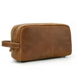 Detail view of vintage brown leather toiletry bag, premium makeup storage pouch for daily use.