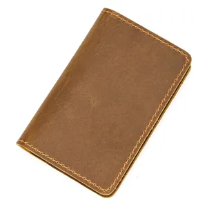 Vintage leather card holder minimalist brown wallet for credit cards and ID travel business.
