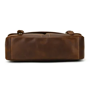 Vintage leather men briefcase bottom detail view, premium crazy horse leather laptop bag design.