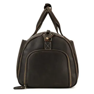 Detailed view of dark brown genuine leather travel duffel bag with durable metal zippers.
