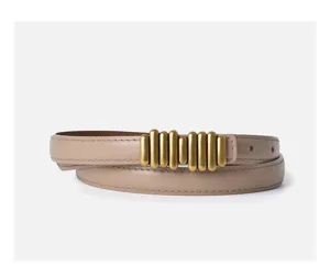 Detail view of a chic beige leather women's belt with a unique golden cylinder buckle