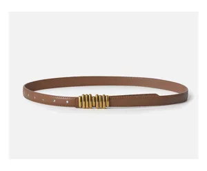 Detailed view of the stylish brown leather women's belt featuring a unique gold metal buckle.