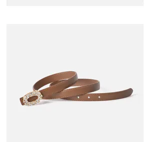 Brown leather women belt featuring a dazzling rhinestone oval buckle detail for daily wear.