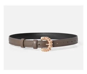 Detailed view of the women's fashion leather belt featuring a unique gold pin buckle.