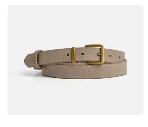 Suede leather belt detail, classic bronze metal buckle, fine stitching, premium texture.