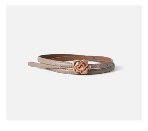 Close-up detail of slim leather belt featuring elegant metallic rose buckle design.