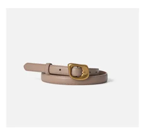 Detailed shot of women's genuine leather belt with irregular metallic buckle in taupe.