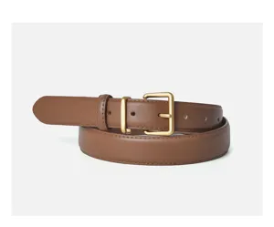 Close-up detail of the brown leather belt, featuring a classic matte gold square pin buckle.
