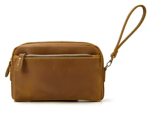 Vue détaillée du sac à poignet en cuir véritable pour homme, pochette vintage marron avec fermeture.