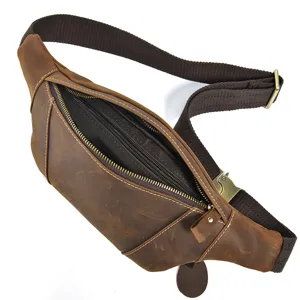 Vintage crazy horse leather waist bag detail showing multiple zipper compartments.