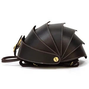 Detailed view of the creative beetle shaped genuine leather backpack in dark brown color.