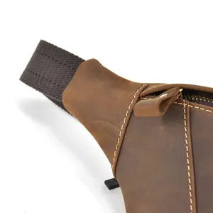 Vintage crazy horse leather chest bag detail, premium genuine cowhide texture and stitching.