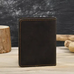 Handmade dark brown leather card holder with contrast orange stitching for daily travel.