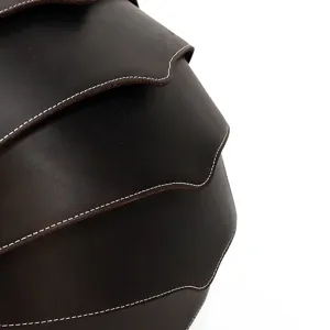 Detailed view of creative crazy horse leather beetle backpack, featuring premium texture and stitching.