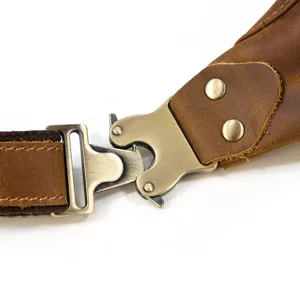 Close up view of vintage genuine crazy horse leather chest bag strap metal buckle.
