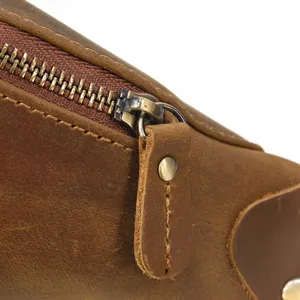 Close-up detail of vintage crazy horse leather bag zipper and durable stitching craft