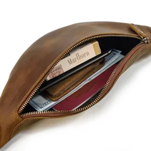 Vintage genuine leather waist bag detail showing large capacity interior storage space for daily use.